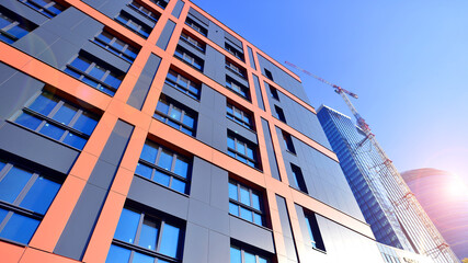 Modern office building with metallic panel facade and windows. Modern architectural details.