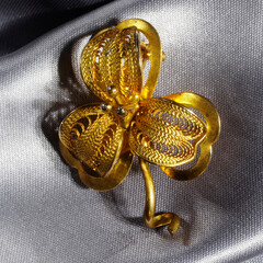 Vintage brooch made of yellow metal in the shape of a flower, made in the Czech Republic