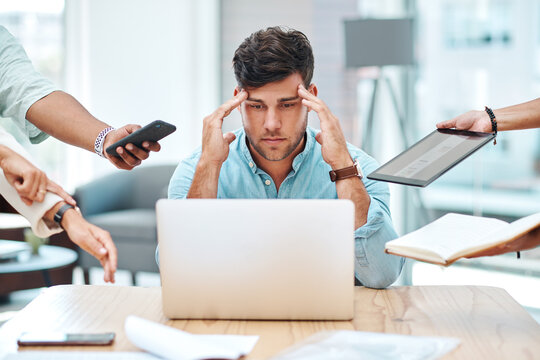 Tired businessman, stress or overworked with laptop in anxiety, depression or multitasking at office. Frustrated man, overwhelmed or employee with headache, colleagues or hands for pressure or demand