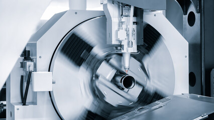 Cutting of metal with sparks fly from laser, modern industrial technology concept