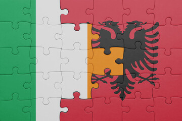 puzzle with the colourful national flag of ireland and flag of albania .