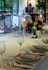 Beautiful table setting, for a holiday. with the dishes .flowers and candles