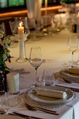 Beautiful table setting, for a holiday. with the dishes .flowers and candles