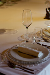 Beautiful table setting, for a holiday. with the dishes .flowers and candles