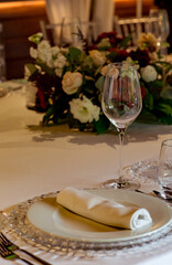 Beautiful table setting, for a holiday. with the dishes .flowers and candles