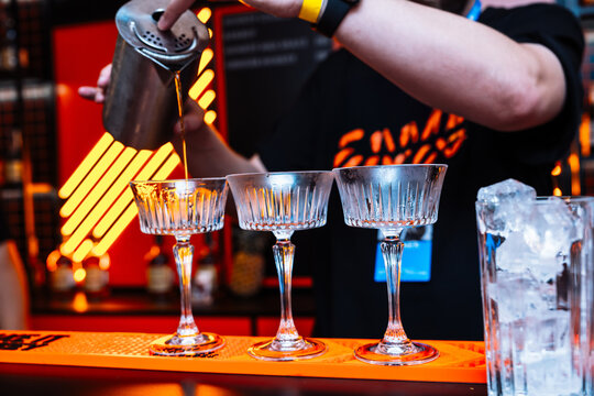 Preparing unique cocktails with precision at an alcohol tasting event