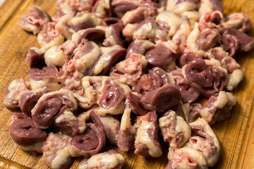 High-quality raw chicken hearts in a bowl, commonly used for various dishes and pet food preparation. Fresh and nutrient-rich