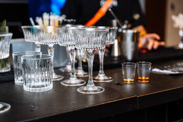 Enjoying alcohol tasting and cocktail preparation at a vibrant bar