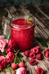 Fresh Raspberries: Juicy, Ripe Berries for a Healthy Summer Snack on a Wooden Background