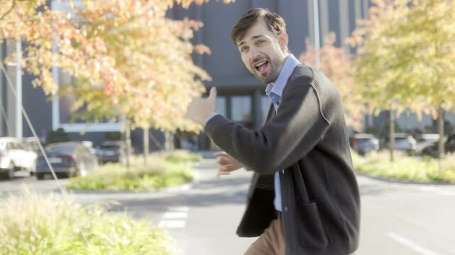 Victorious Employee Celebrates in Front of Office Building