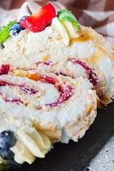 Delicate Meringue Roulade with Blueberries, Strawberries, and Mascarpone Cream