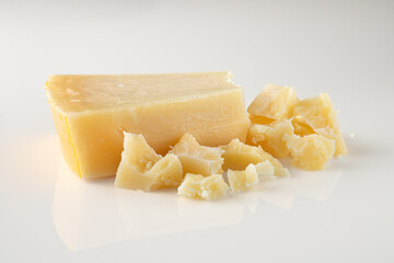 Authentic Italian Parmigiano Reggiano: Aged Cheese Wedge Isolated on White Background
