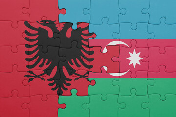puzzle with the colourful national flag of albania and flag of azerbaijan .