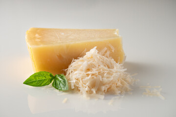 Authentic Italian Parmigiano Reggiano: Aged Cheese Wedge Isolated on White Background