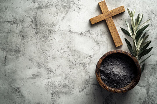 Religion, faith, liturgy, Ash Wednesday, Lent background. Brown wooden cross, ceremonial ash bowl and olive branch on grunge gray background