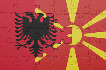 puzzle with the colourful national flag of albania and flag of macedonia .