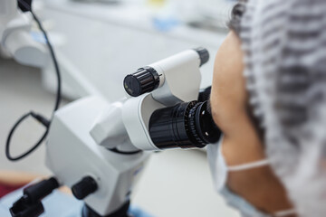 A microscope closeup in a lab, emphasizing precision in scientific investigation and analysis