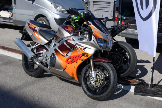 ISTANBUL, TURKEY - OCTOBER 27, 2024: Honda CBR 600 motorbike gray and orange standing at the park area.