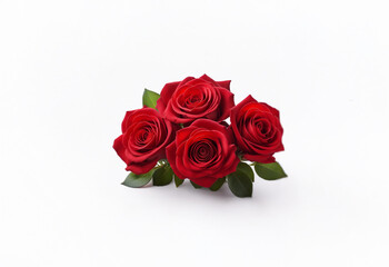 Fototapeta premium A bouquet of four red roses with green leaves lays on a white background.