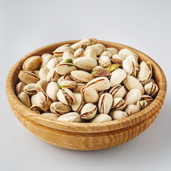 Fresh Pistachios: Nutritious Green Nuts on a White Background