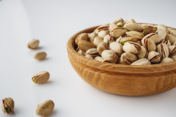 Fresh Pistachios: Nutritious Green Nuts on a White Background