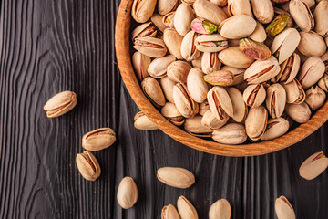 Cracked Pistachios: Healthy, Crunchy Nuts on Wooden and Black Backgrounds