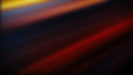 Dynamic abstract gradient featuring bold yellow, red, orange, and dark blue hues with a grainy texture, ideal for vibrant, energetic backgrounds and designs