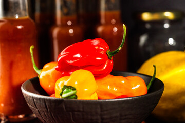 Superhot Habanero Peppers: Fresh and Spicy Chili with Ingredients on a Wooden Background