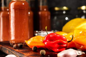 Superhot Habanero Peppers: Fresh and Spicy Chili with Ingredients on a Wooden Background