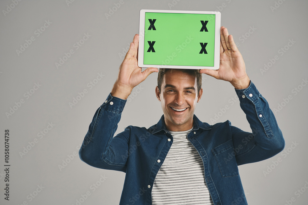 Poster portrait, green screen and man with tablet, excited and happy person on gray studio background. face
