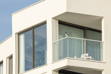 Architectural detail of exterior luxury apartment facade in contemporary architecture Dutch design with corner balcony