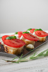 Italian Bruschetta on Ciabatta: Fresh Tomatoes, Garlic, and Olive Oil on a Wooden Table, Rustic