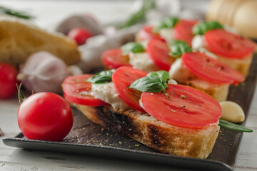 Italian Bruschetta on Ciabatta: Fresh Tomatoes, Garlic, and Olive Oil on a Wooden Table, Rustic