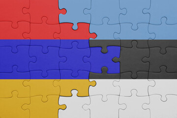 Fototapeta premium puzzle with the colourful national flag of armenia and flag of estonia .