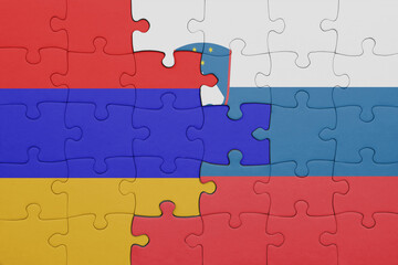 Fototapeta premium puzzle with the colourful national flag of armenia and flag of slovenia .