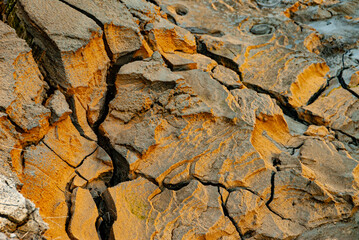 cracked ground with cracks, its notoriety chiefly because of its sulphurous mud springs called solfataras and steam springs called fumaroles.