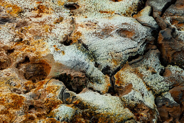 cracked ground with cracks, its notoriety chiefly because of its sulphurous mud springs called solfataras and steam springs called fumaroles.