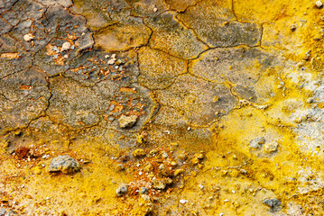 cracked ground with cracks, its notoriety chiefly because of its sulphurous mud springs called solfataras and steam springs called fumaroles.