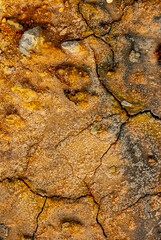 cracked ground with cracks, its notoriety chiefly because of its sulphurous mud springs called solfataras and steam springs called fumaroles.