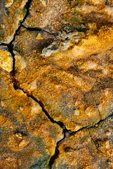 cracked ground with cracks, its notoriety chiefly because of its sulphurous mud springs called solfataras and steam springs called fumaroles.