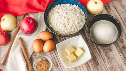 Ingredients Charlotte: A Delicious Apple Pie with Cinnamon on a Wooden Table
