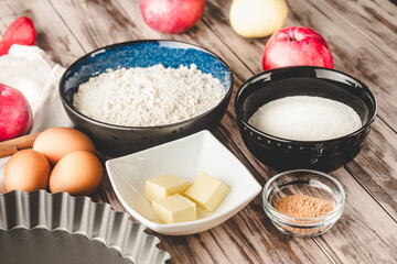 Ingredients Charlotte: A Delicious Apple Pie with Cinnamon on a Wooden Table