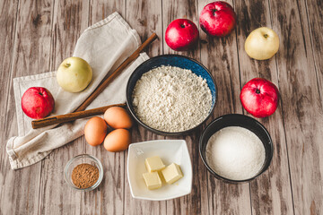 Ingredients Charlotte: A Delicious Apple Pie with Cinnamon on a Wooden Table