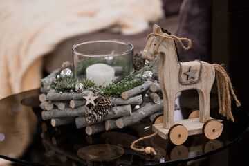 Cozy Christmas Decor with Wooden Horse and Candle Centerpiece