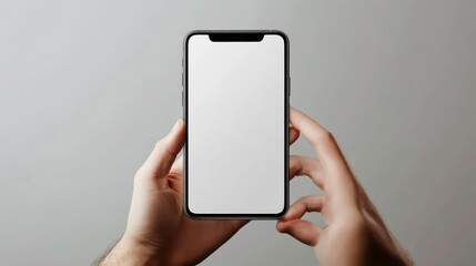 Hands holding a smartphone with a blank screen.