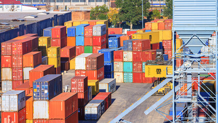Stacked containers in the container terminal. Global transportation and logistic freighting ship service