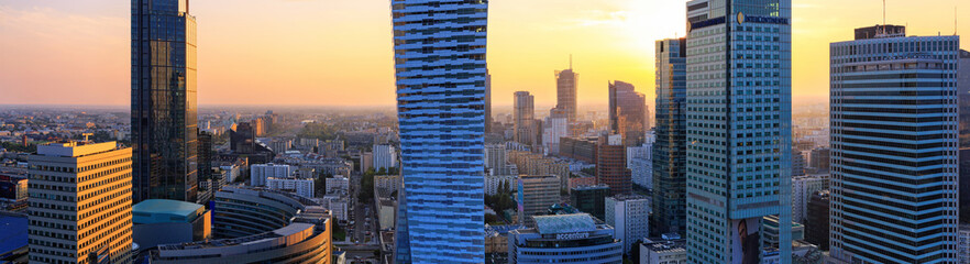 Cityscape at sunset, panorama, banner - top view of the Downtown district of Warsaw with high-rise...