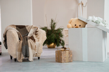 Cozy Living Room Scene with Plush Teddy Bear and Decorative Gifts