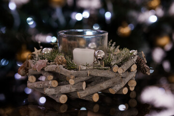 Rustic Christmas Candle Holder with Pine Decor and Soft Bokeh Background