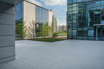 Fototapeta premium Modern Urban Architecture Featuring Sleek Glass Buildings and Green Spaces